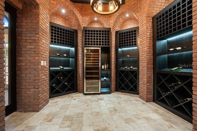 wine room with brick wall and stone finish flooring