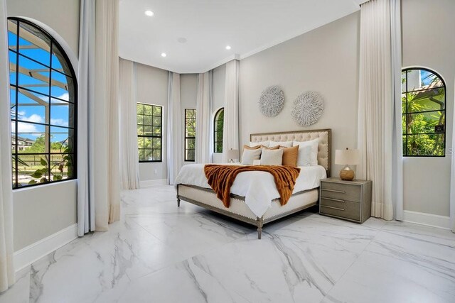 bedroom with recessed lighting, baseboards, and marble finish floor