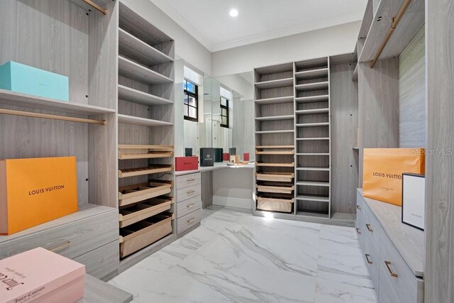 spacious closet featuring marble finish floor