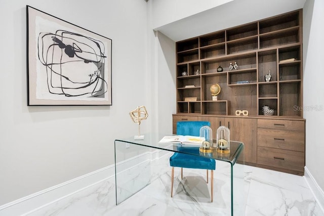 home office with baseboards and marble finish floor