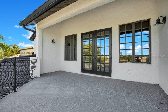 view of patio / terrace featuring french doors and a balcony