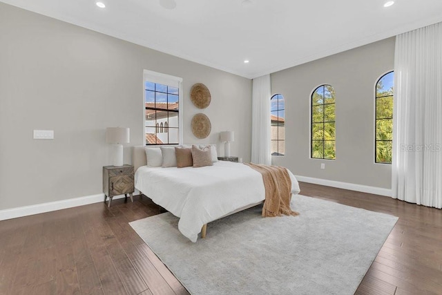 bedroom with recessed lighting, baseboards, and dark wood-style flooring