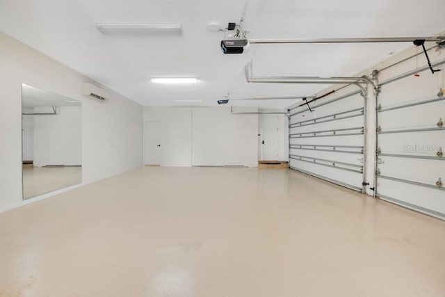 garage featuring a wall mounted air conditioner and a garage door opener