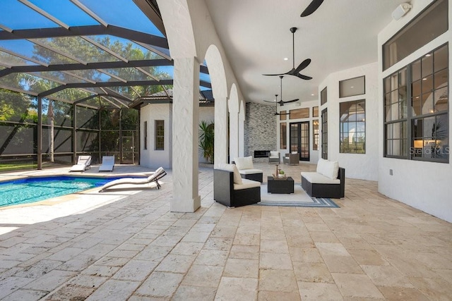 view of patio with a lanai, an outdoor pool, an outdoor hangout area, and ceiling fan