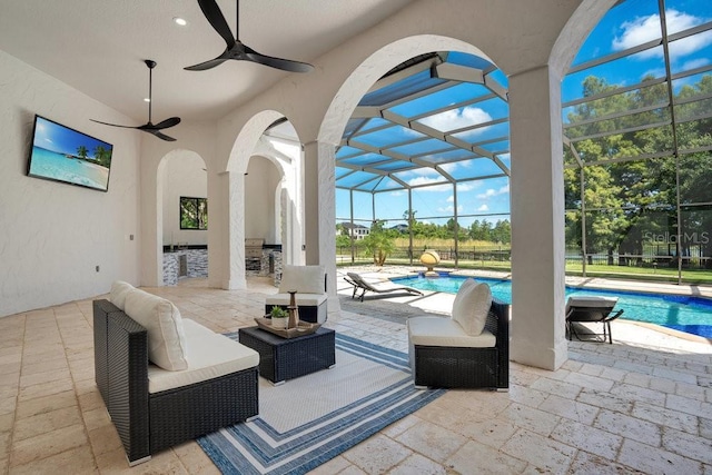 view of patio / terrace featuring an outdoor pool, glass enclosure, an outdoor hangout area, and ceiling fan