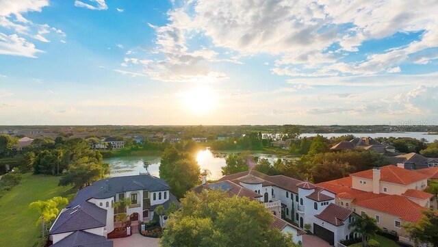 aerial view featuring a residential view and a water view