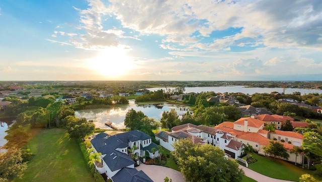 birds eye view of property with a residential view and a water view