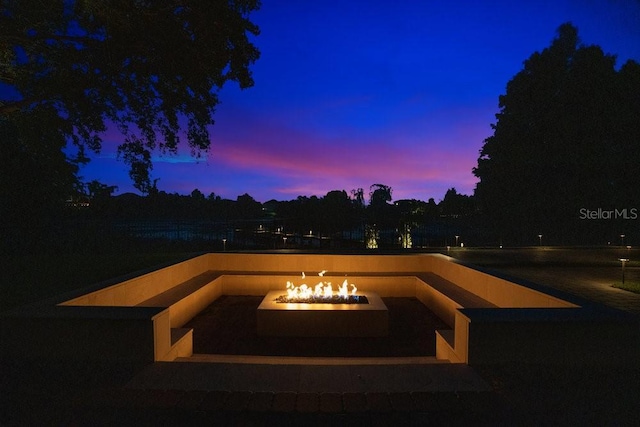 exterior space with an outdoor fire pit