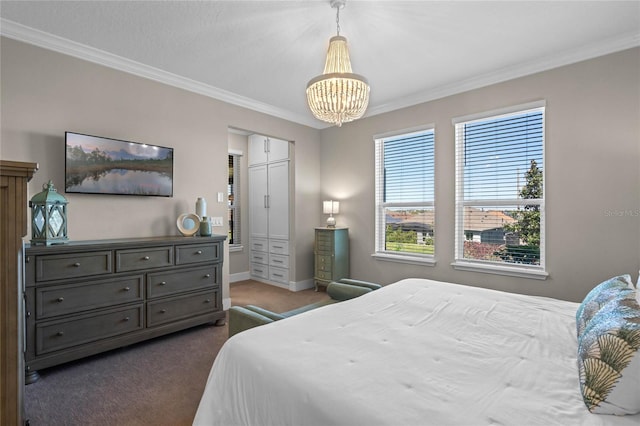 bedroom with a chandelier, ornamental molding, and dark carpet