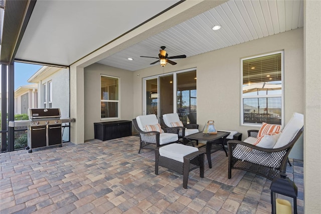 view of patio / terrace featuring outdoor lounge area, area for grilling, and a ceiling fan