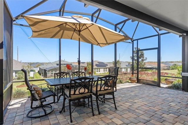 sunroom featuring a residential view