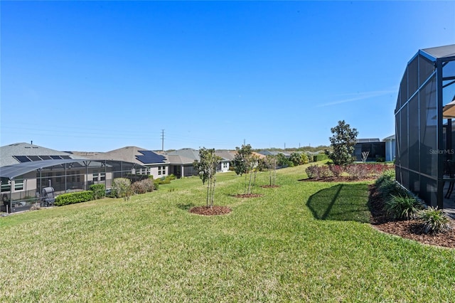 view of yard with a lanai