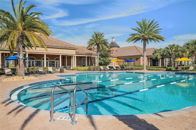 community pool with a patio area