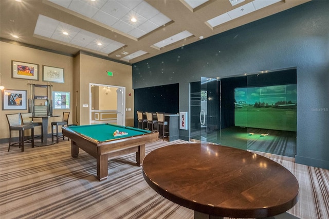 recreation room featuring baseboards, carpet flooring, a towering ceiling, golf simulator, and coffered ceiling