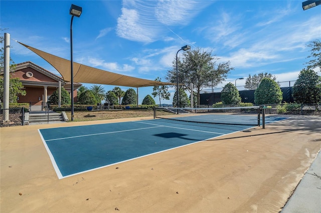 view of tennis court with fence