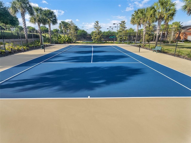 view of tennis court with fence