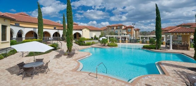 community pool featuring a patio