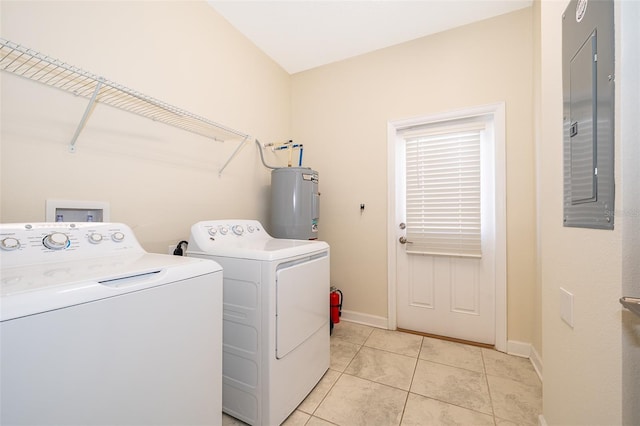 laundry area with washing machine and clothes dryer, light tile patterned floors, water heater, laundry area, and electric panel