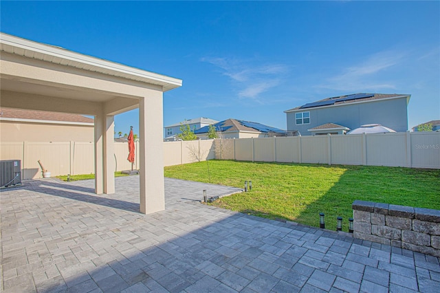 view of patio featuring cooling unit and a fenced backyard