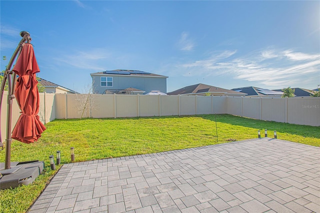 view of yard with a patio and a fenced backyard