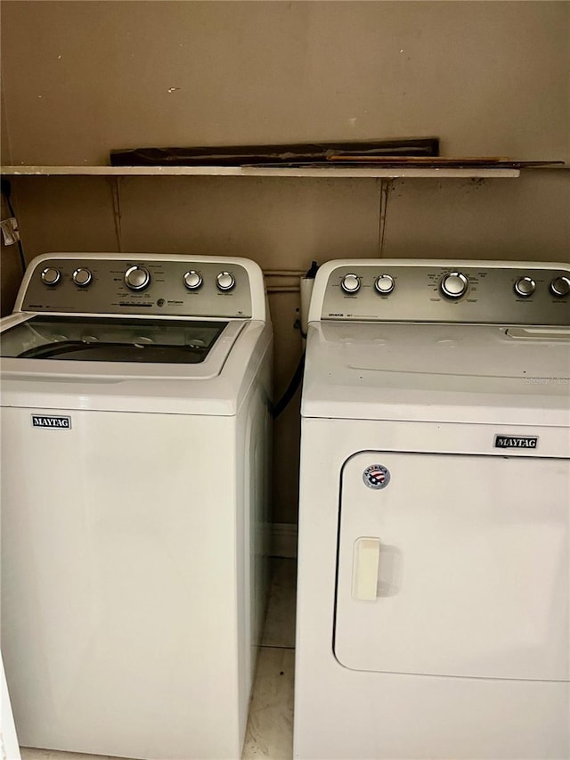 laundry area featuring laundry area and washer and dryer