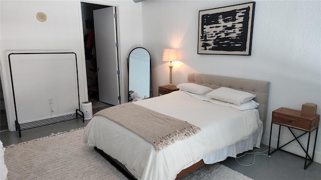 bedroom with finished concrete flooring