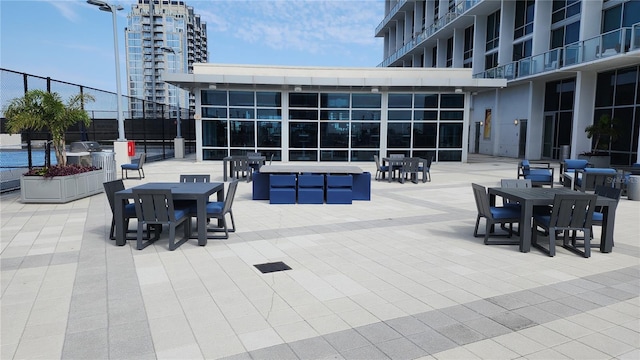 view of patio / terrace featuring outdoor dining area and fence