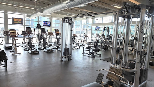 gym with floor to ceiling windows