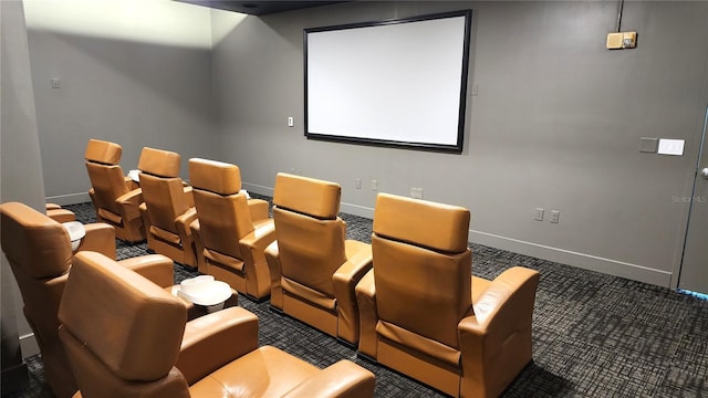 carpeted home theater room with baseboards