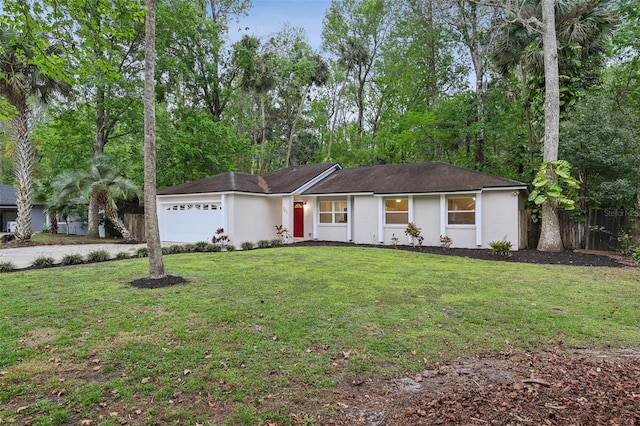 ranch-style house with a front lawn, an attached garage, fence, and stucco siding