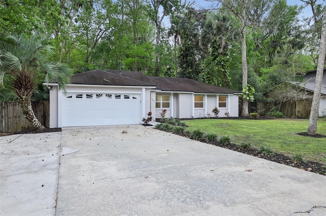 ranch-style home with driveway, a garage, fence, a front lawn, and stucco siding