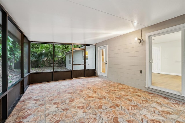 unfurnished sunroom with plenty of natural light