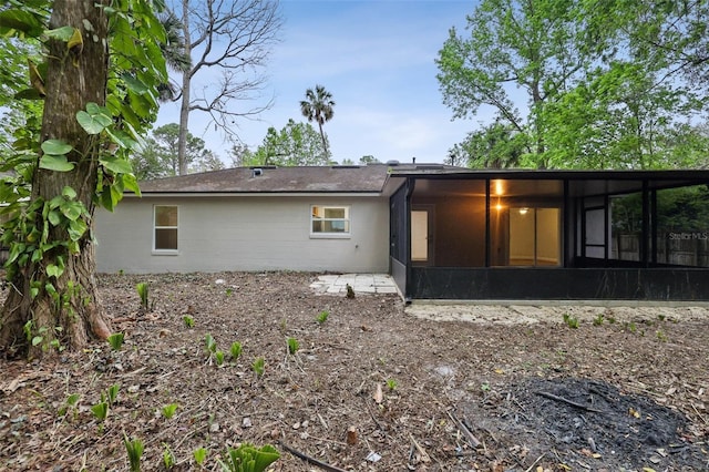 rear view of house with a sunroom