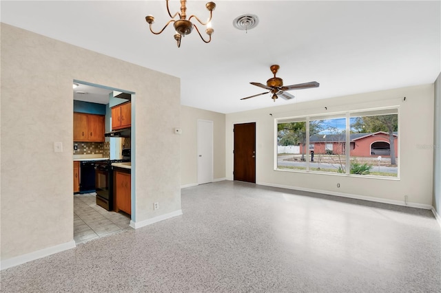 unfurnished living room with light speckled floor, visible vents, baseboards, and ceiling fan with notable chandelier