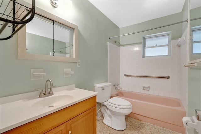 bathroom with shower / bathing tub combination, vanity, toilet, and speckled floor