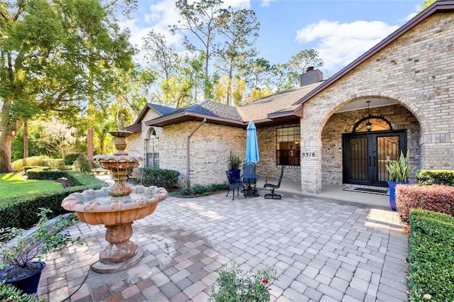 view of patio featuring french doors