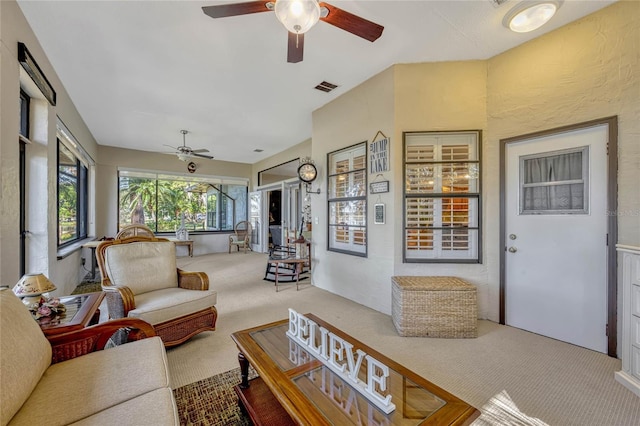 sunroom featuring visible vents and ceiling fan