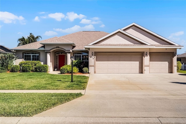 ranch-style house with stucco siding, driveway, a garage, and a front lawn