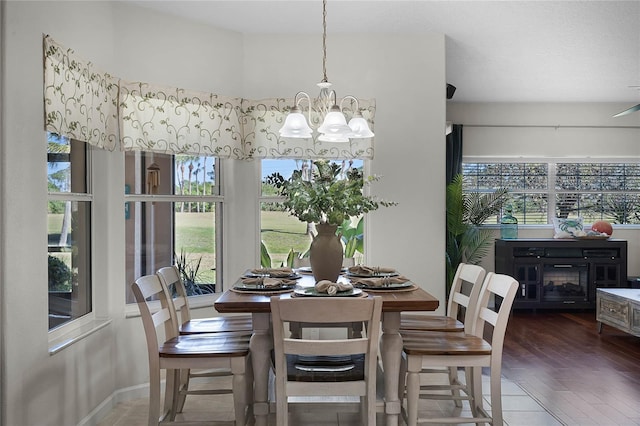 dining room with a chandelier and wood finished floors