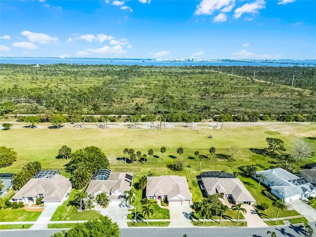 drone / aerial view with a residential view and a water view