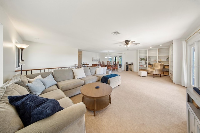 living area featuring recessed lighting, visible vents, light colored carpet, and a ceiling fan