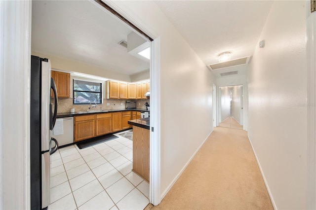 13224 Casper Ln, Clermont, FL 34711 - hallway with attic access, baseboards, light tile patterned floors, visible vents, and a sink