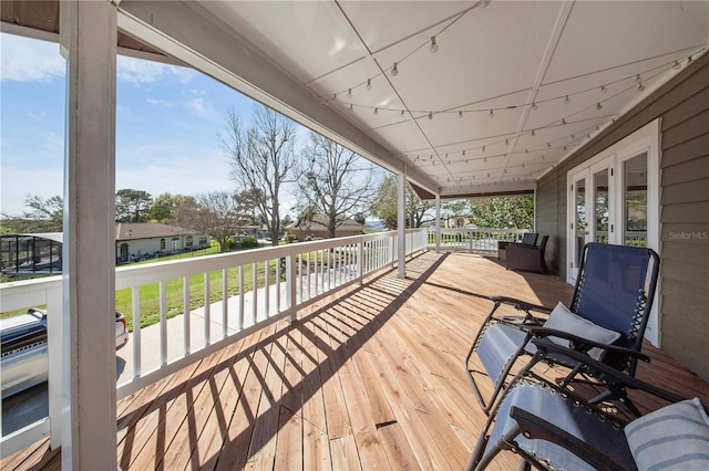 13224 Casper Ln, Clermont, FL 34711 - wooden deck featuring a porch and french doors