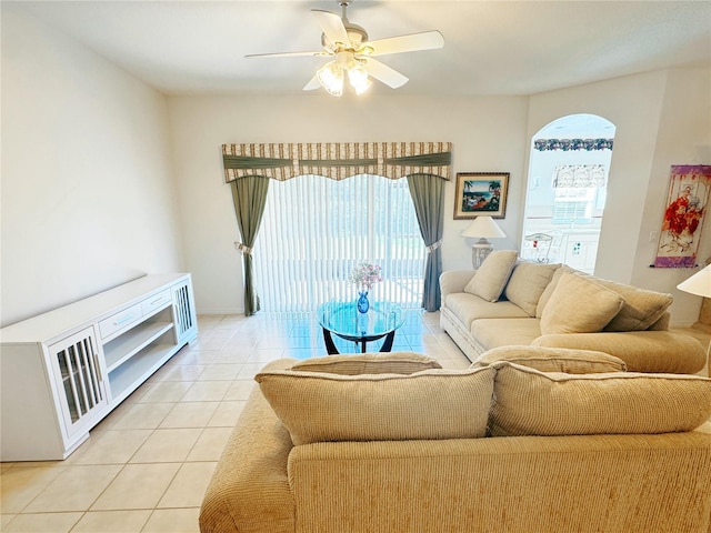 living room with light tile patterned floors and ceiling fan