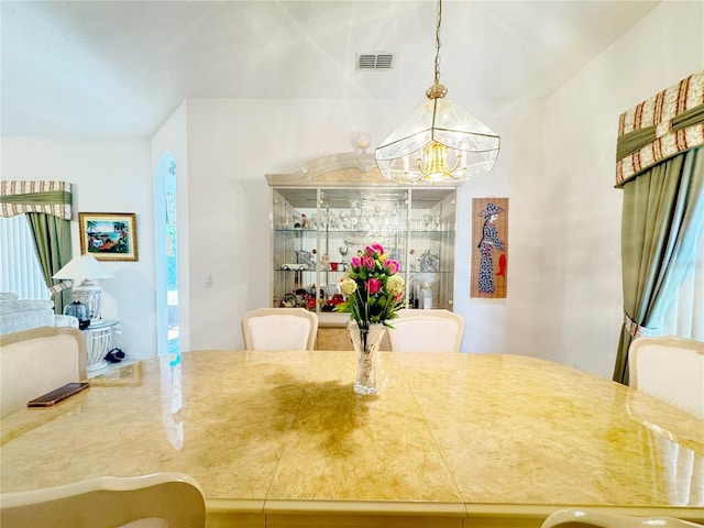 dining room featuring visible vents and an inviting chandelier