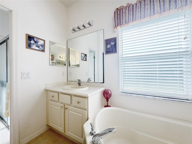 bathroom featuring a bath, tile patterned floors, vanity, and a shower with shower door