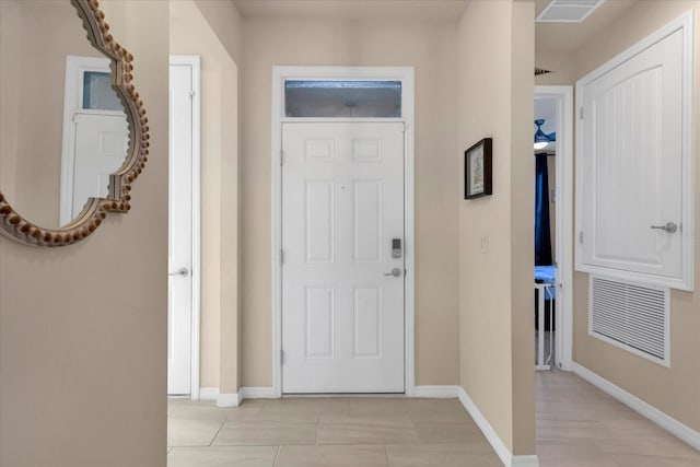 foyer featuring visible vents and baseboards