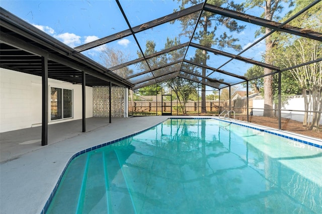 view of pool featuring a lanai, a fenced in pool, a patio, and a fenced backyard