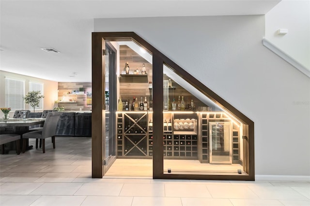 wine area featuring tile patterned flooring and visible vents