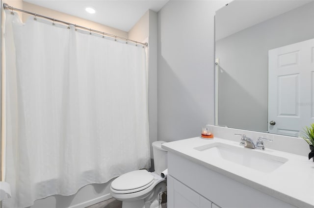 bathroom with vanity, toilet, and shower / bathtub combination with curtain